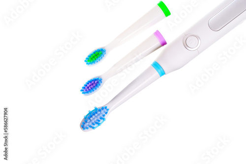 White Electric Toothbrush with a Set of Brush Heads