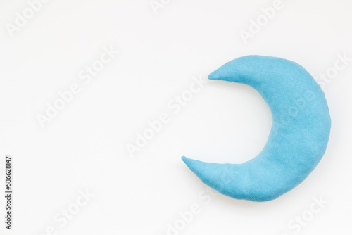 Soft pillow in shape of moon. Bedding for good sleep and rest