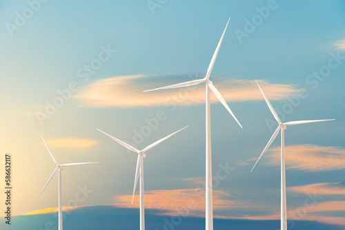 Wind energy. Electric wind turbines in the evening sky. Renewable energy, a new energy business alternative that is friendly to the environment and community.