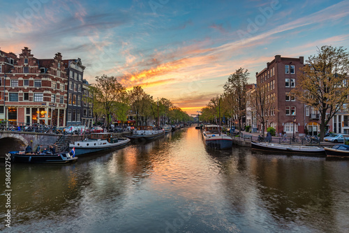 Amsterdam Netherlands  sunset city skyline at canal waterfront
