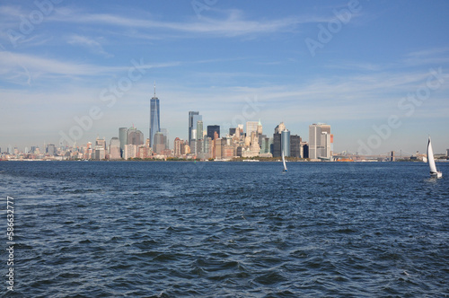 Beautiful shot of Manhattan skyscrapers against blue ocean in New York