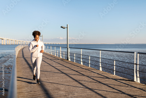 Active Lifestyle. Happy Young African American Woman In Sportswear Jogging Outdoors