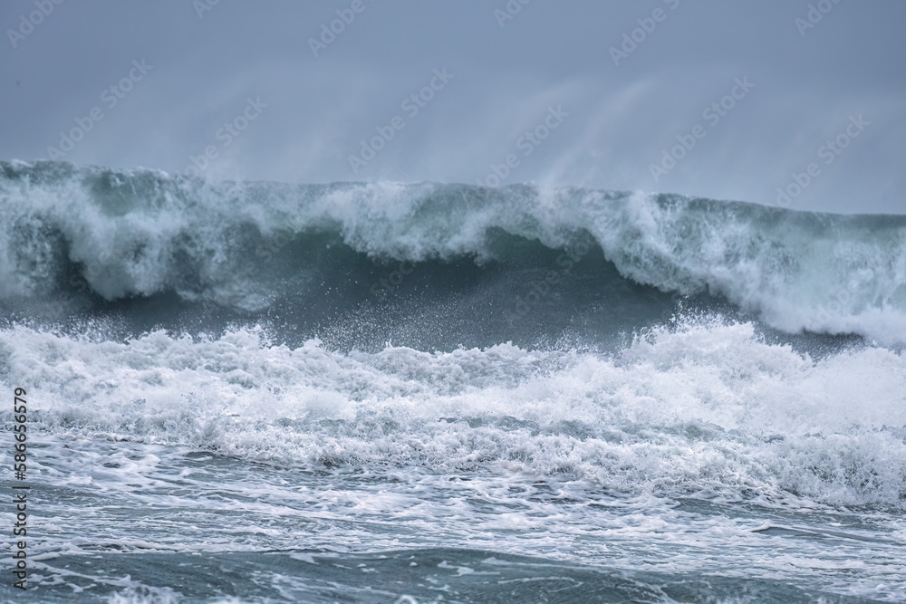 crashing waves off chapel Porth beach cornwall england uk crashing waves off chapel Porth beach cornwall england uk