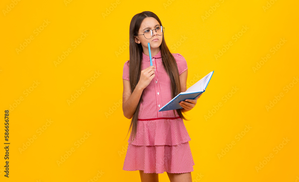 Thinking pensive clever teenager schoolgirl. School child with book. Learning and education.