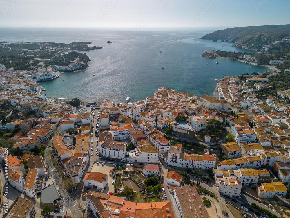 Aerial images of Cadaqués on the Costa Brava of Girona European tourist town on the border with France Catalonia images of the beach transparent turquoise blue sea