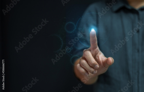  business man hand pointing at abstract glowing polygonal sphere and digital business interface on blurry blue background. Future, innovation and technology concept.