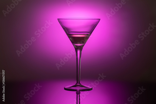 glass goblet with a drink in the back colored light, the concept of minimalism, noir style, 