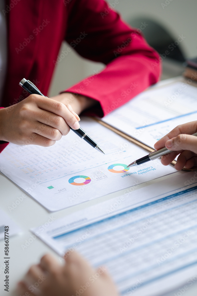 Fototapeta premium Two businessmen are brainstorming together and reviewing the company financial documents that the finance department has summarized, they are business partners. Business administration concept.