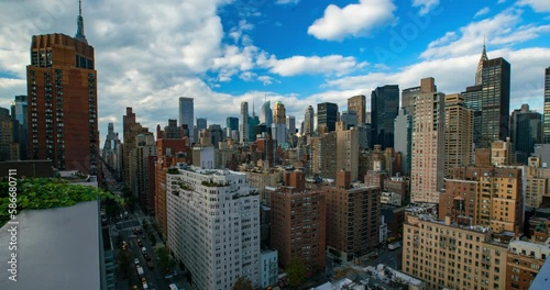 Lockdown Time Lapse Shot Of Buildings Against Sky In Downtown City - New York City, New York