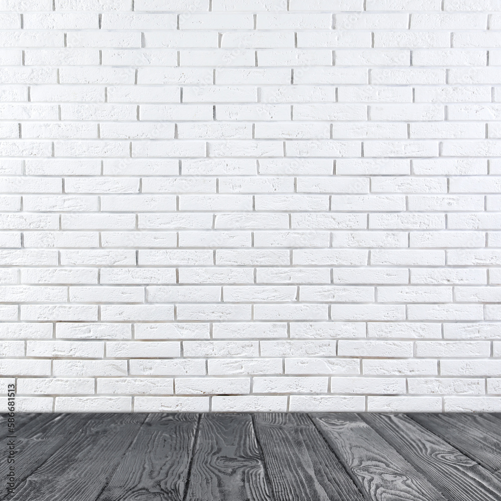 Room with white brick wall and wooden floor Room with white brick wall and wooden floor