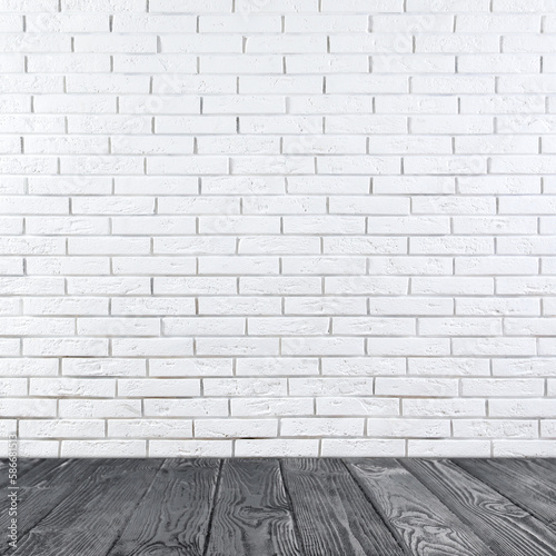 Room with white brick wall and wooden floor