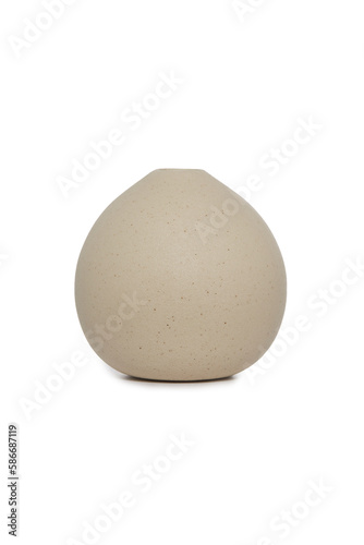 Close-up shot of a beige ceramic scandinavian vase. An empty small vase with a narrow neck is isolated on a white background. Home decor element. Front view.