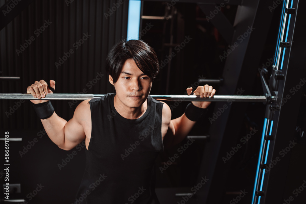 Man working out Bodybuilder with barbell weights at the gym. bodybuilder doing exercises with barbell. training sport healthy lifestyle bodybuilding, Athlete builder muscles lifestyle. Man working out Bodybuilder with barbell weights at the gym. bodybuilder doing exercises with barbell. training sport healthy lifestyle bodybuilding, Athlete builder muscles lifestyle.