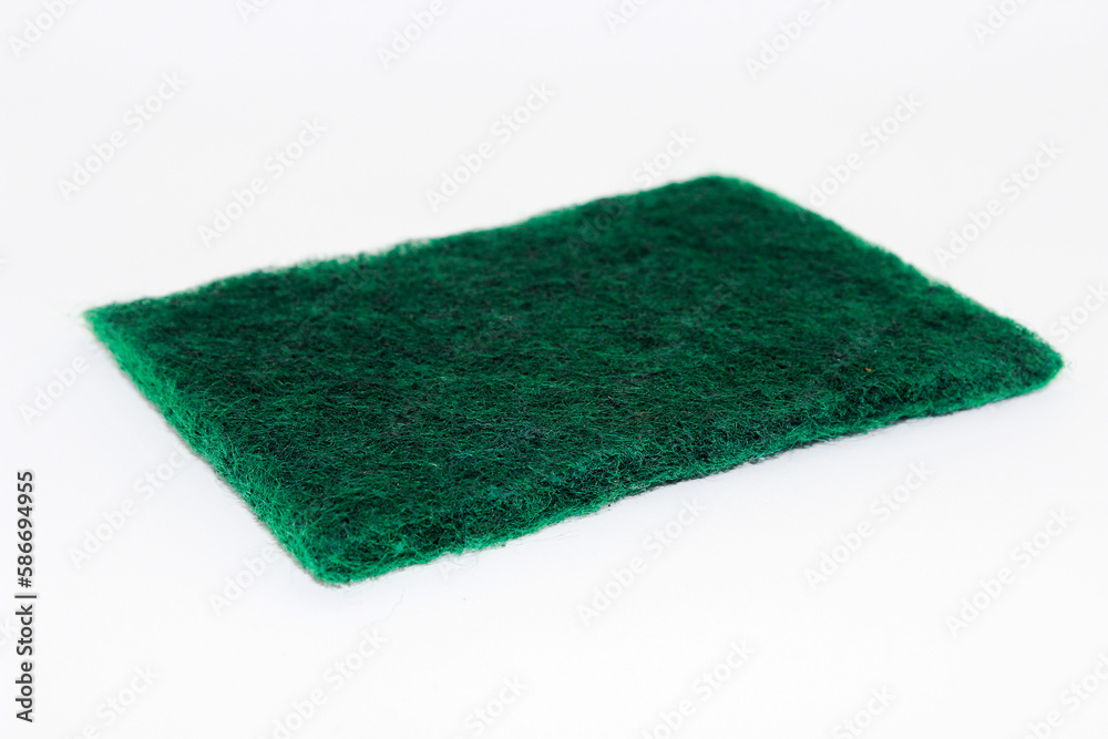 Green hand scrubber with fine fibers isolated on white background Green hand scrubber with fine fibers isolated on white background