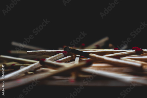 playing mikado with matchsticks, horizontal closeup 
