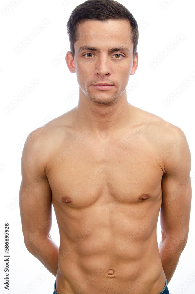 Young attractive man posing in the studio. Young attractive man posing in the studio.