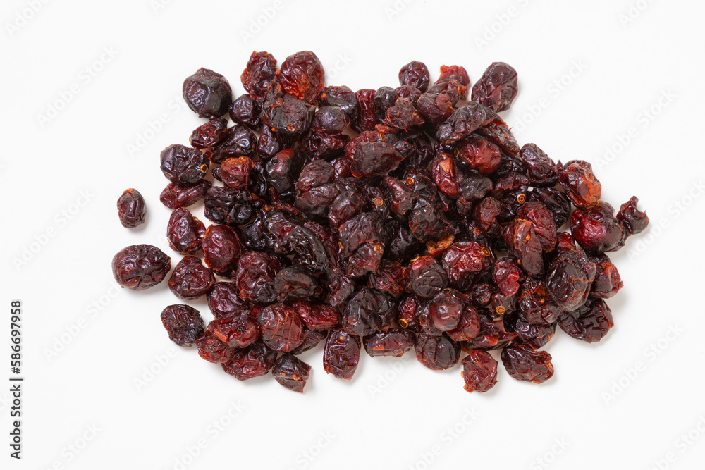 Dried cranberries on a white surface Dried cranberries on a white surface