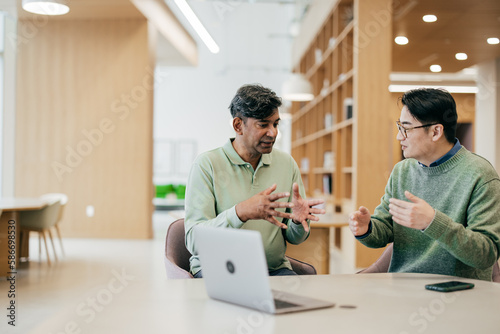 Photography Business colleagues in meeting discussing an e-commerce project