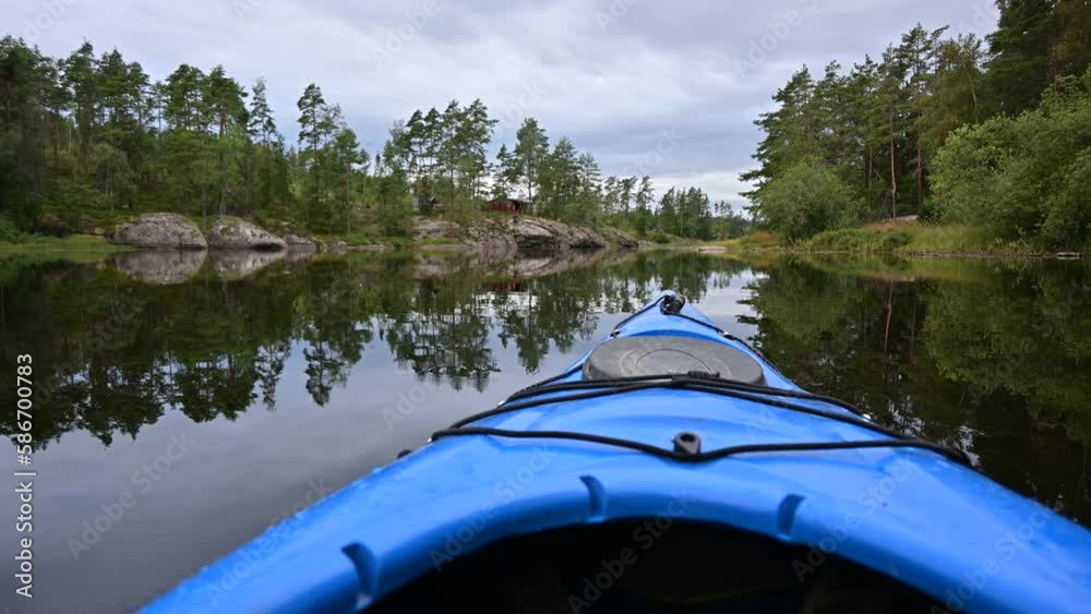 First person view of kayaking in a magical sunset evening on a lake in Norway First person view of kayaking in a magical sunset evening on a lake in Norway