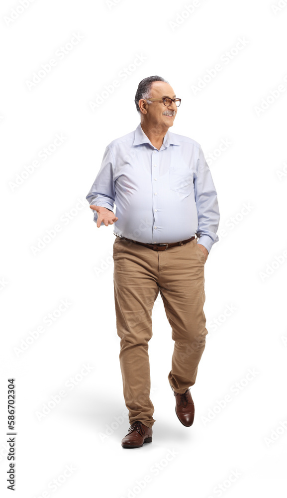 Corpulent mature man walking towards camera and looking to the side Corpulent mature man walking towards camera and looking to the side