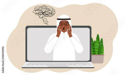 Online consultation with a psychologist. Laptop with a muslim man with confused thoughts. Psychotherapeutic practice, psychiatric consultation.