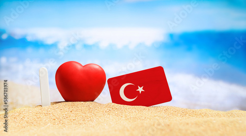 Fototapeta Naklejka Na Ścianę i Meble -  I love Turkey. Flag of Turkey on the beach with a red heart. vacation and travel concept.
