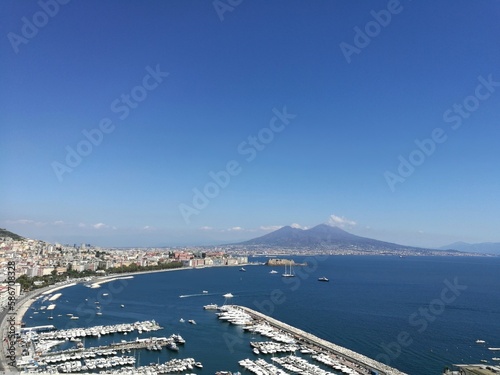Naples, Italy: panoramic view of Naples seafront and Mergellina from Posillipo Hill. The Gulf of Naples with Mount Vesuvius in the background