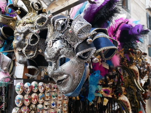 Venice, Italy: close up of colorful typical Venetian masks on a stall in Venice