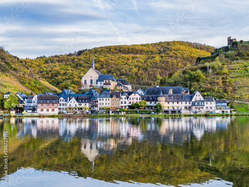 Beilstein village wiht clear reflection on Moselle river during autumn in Cochem-Zell district, Germany