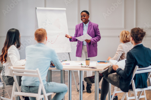 African american businesswoman holding a presentation during a meeting in an office