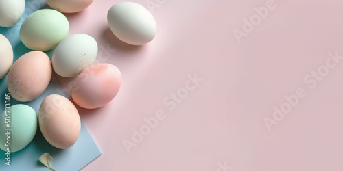 Pastel Easter eggs on blue background top view. Springtime holidays concept with copy space. Top view