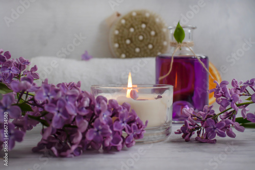 Massage brush  lilac flower on a light background