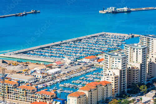 View of a marina in Gibraltar town and Bay of Gibraltar from The Upper Rock. UK