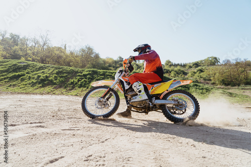 Man riding motorbike on motocross track.Extreme and Adrenaline. Motocross rider in action. Motocross sport. Active lifestyle