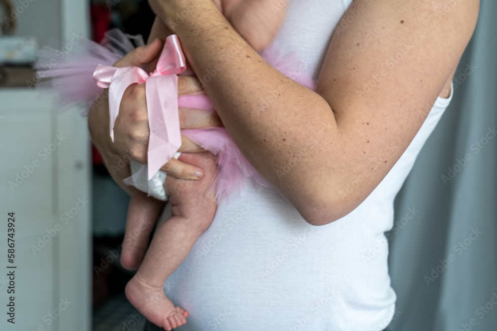 close-up of a young father and his newborn baby at home, loving parent with small daughter, happy father's day close-up of a young father and his newborn baby at home, loving parent with small daughter, happy father's day