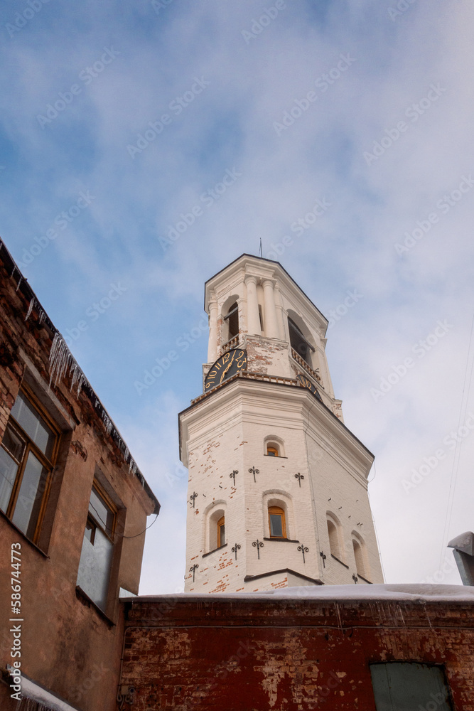 View of old Clock Tower on sunny winter day. Belfry of Vyborg Cathedral, Vyborg, Russia