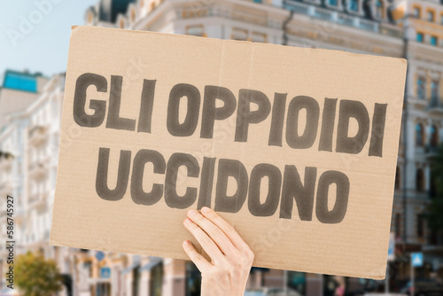 The phrase " Opioids kill " on a banner in men's hands is isolated on a white background. Medicine supply. Deadly drugs. Death. Treatment. Pharmacy. Dangerous. Drug addiction