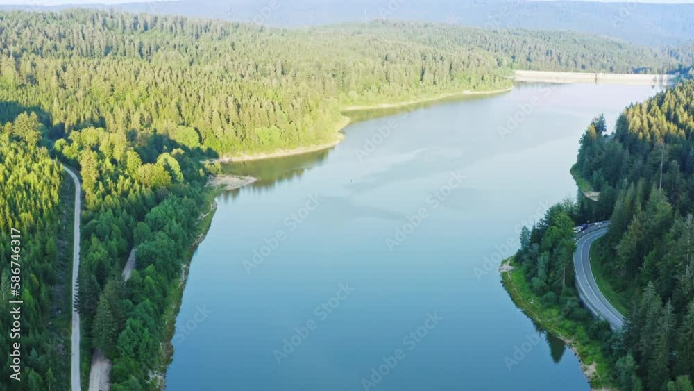 An aerial view of the Schwarzenbachtalsperre dam, showcases the impressive engineering feat of the massive concrete structure. Germany, Black forest (Schwarzwald). An aerial view of the Schwarzenbachtalsperre dam, showcases the impressive engineering feat of the massive concrete structure. Germany, Black forest (Schwarzwald).