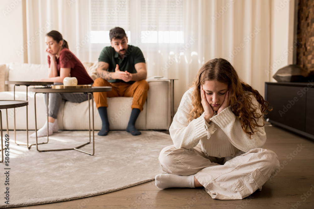 Daughter feeling sad because of her parents argument. Daughter feeling sad because of her parents argument.