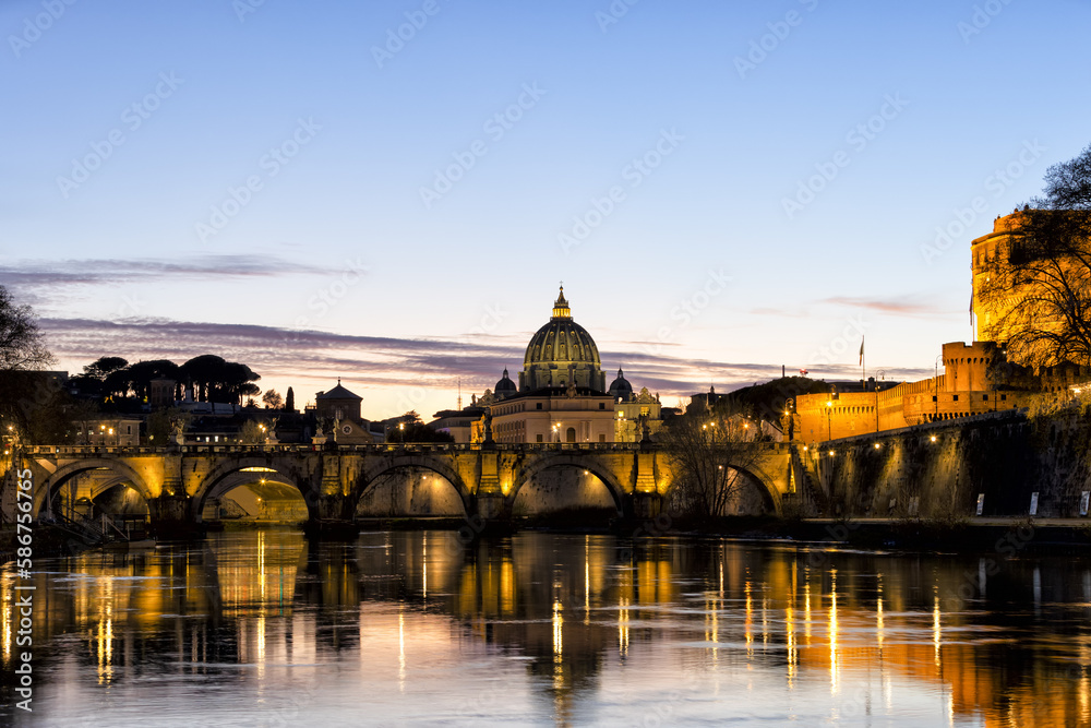 Incredible day to night sunset of Rome, Italy, with the Ponte Sant'Angelo, the River Tiber with reflections on the water and St. Peter's Basilica in the Vatican