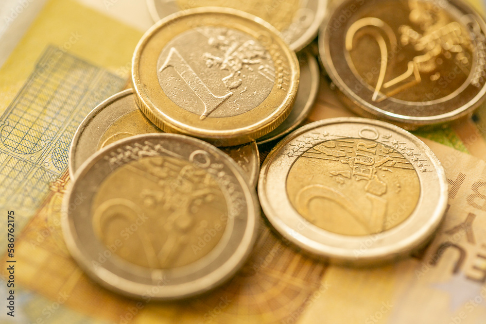Euro currency. Euro banknotes and coins.EU currency.Euro banknotes and euro coins close-up.Money and finance.Expenses and incomes in European countries. Euro currency. Euro banknotes and coins.EU currency.Euro banknotes and euro coins close-up.Money and finance.Expenses and incomes in European countries.