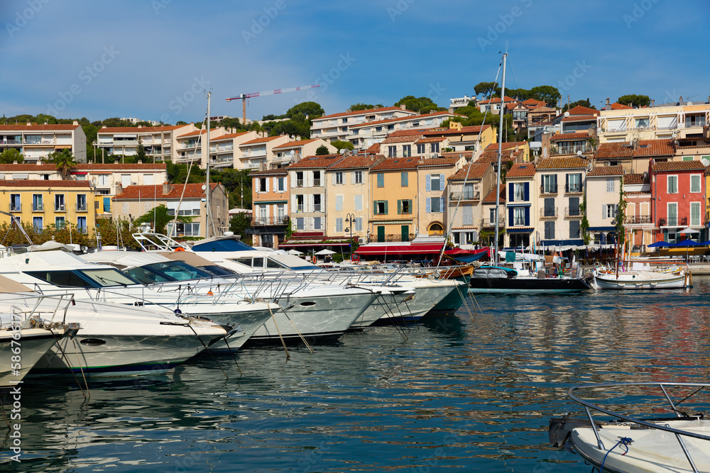 View on boats in marina in bay of Cassis resort town on sunny day at Provence, France