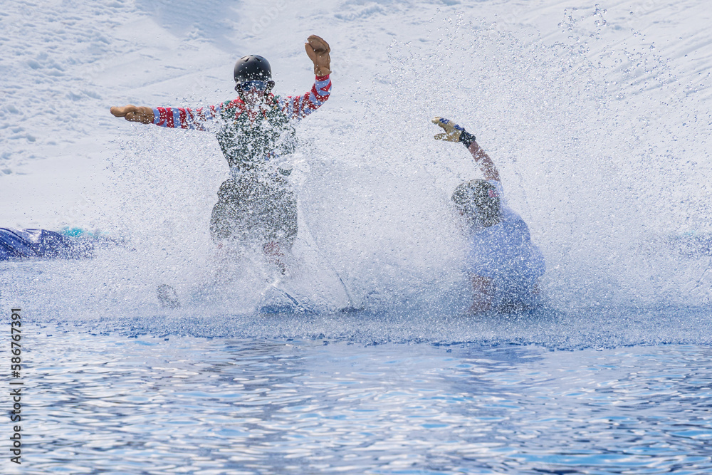 Naklejka premium People are enjoying Pond skim at the end of ski season