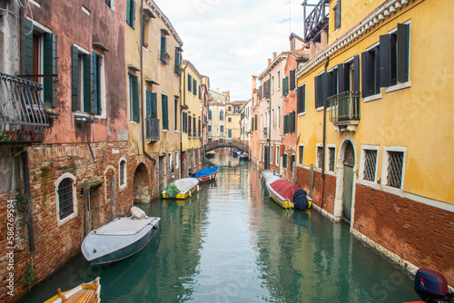 Colorful houses, canal boats in Venice, Italy at winter. 