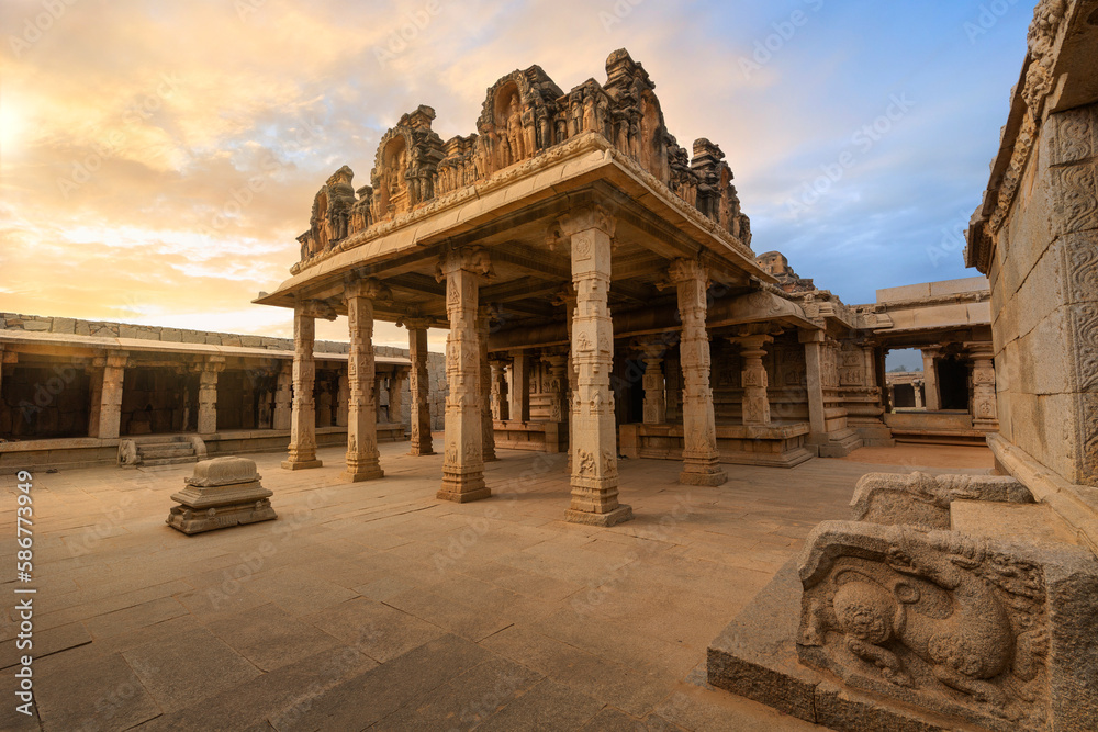 Ancient architecture of the Hazara Rama temple with intricate stone carvings at Hampi, Karnataka India