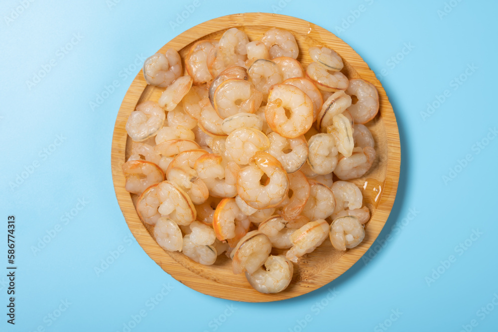 top view fresh cooked unskin shrimps on blue background horizontal composition top view fresh cooked unskin shrimps on blue background horizontal composition