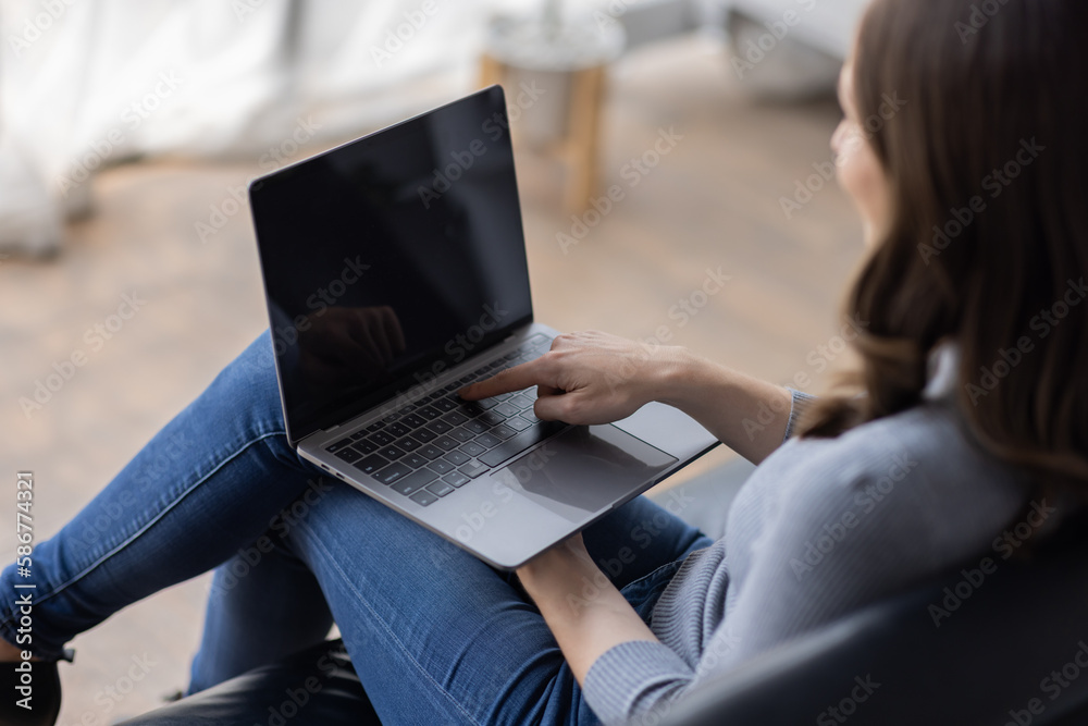 Fototapeta premium Portrait of young happy canadian female freelancer checking email news online sitting on sofa,for friends, studying, blogging, resting and chatting online. High quality photo