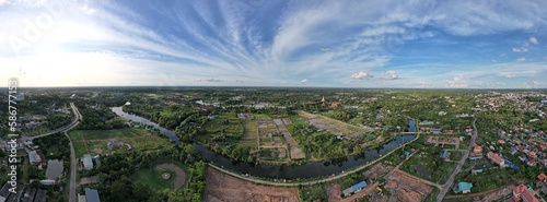 Panoramic of the view of the city, green trees and blue sky is a symbol of the progress and innovation of human civilization.