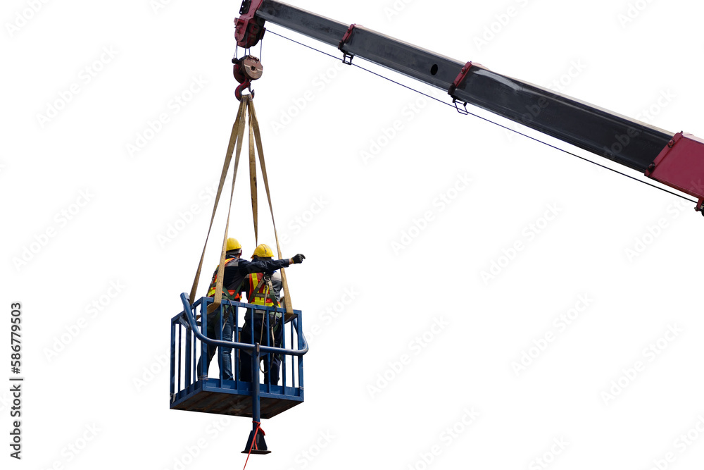Construction worker wearing safety harnesses in mobile crane bucket at construction site. working at heights above ground ,safety for working at heights concept