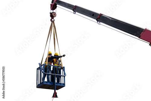 Construction worker wearing safety harnesses in mobile crane bucket at construction site. working at heights above ground ,safety for working at heights concept